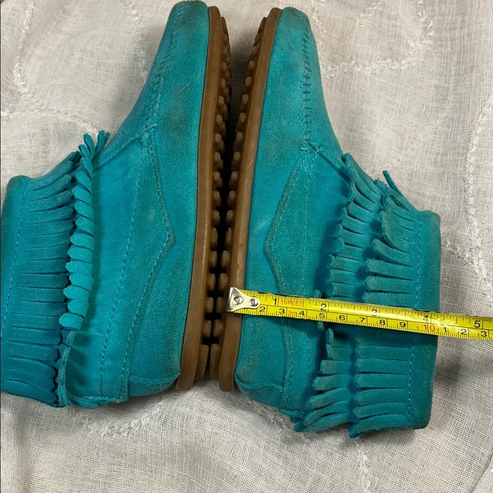Minnetonka leather fringe moccasins with side zipper